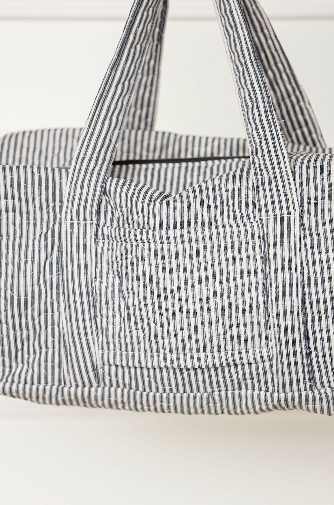 Black Stripe Quilted Duffle Bag